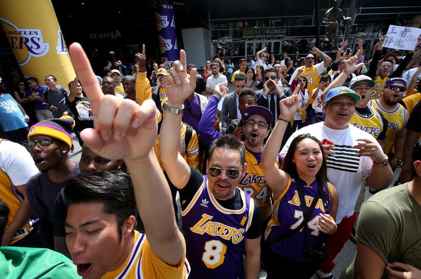LOS ANGELES, CALIF. - APR. 13, 2016. Lakers fans get a Kobe chant going outside Staples Center in Los Angeles before Laker great Kobe Bryant's final game on Wednesday, April 13, 2016. (Luis Sinco/Los Angeles Times)