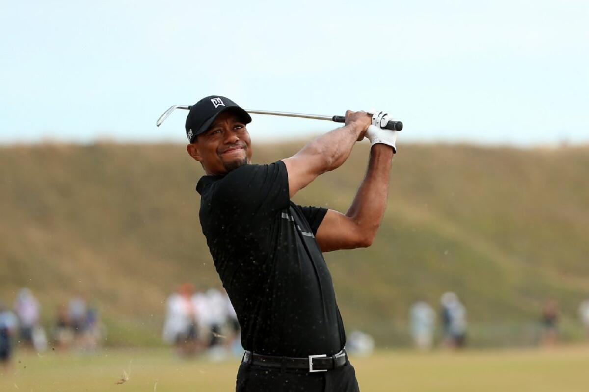 Tiger Woods watches his tee shot on the 11th hole during the first round of the U.S. Open on Thursday at Chambers Bay Golf Course in University Place, Wash.