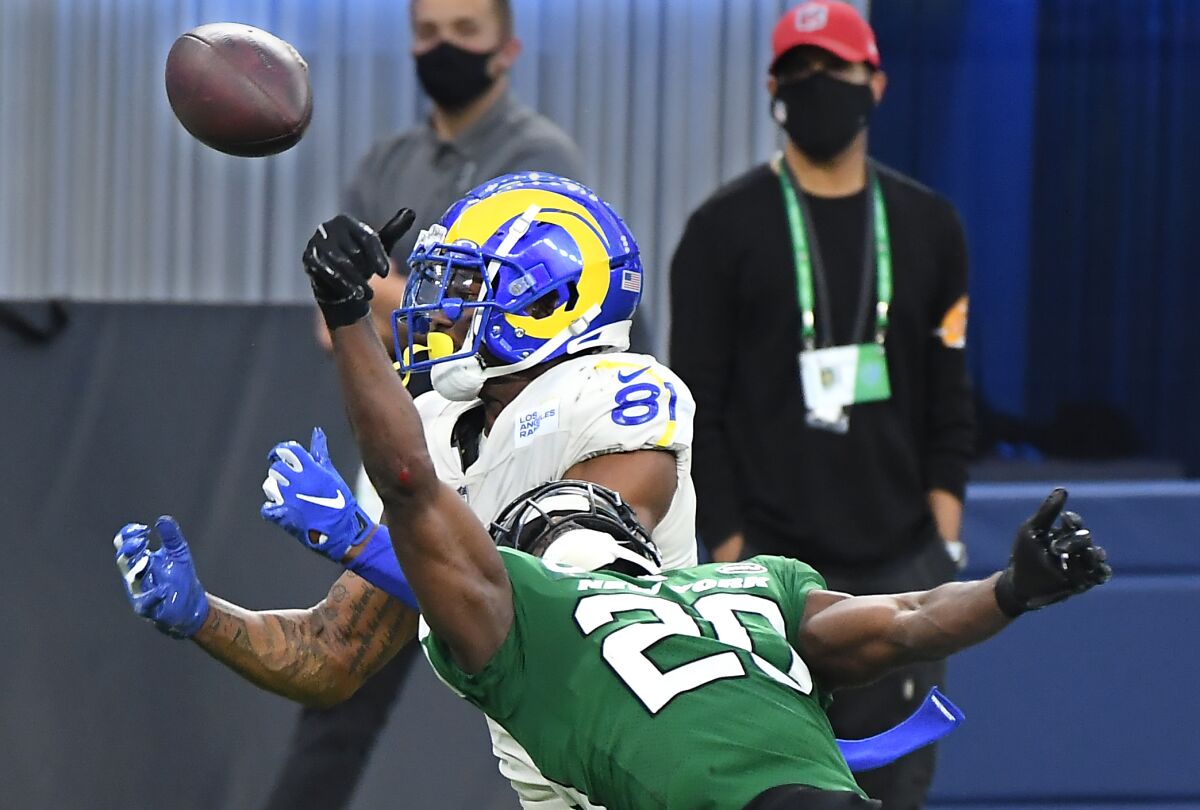 Jets safety Marcus Maye knocks the ball away from Rams tight end Gerald Everett.