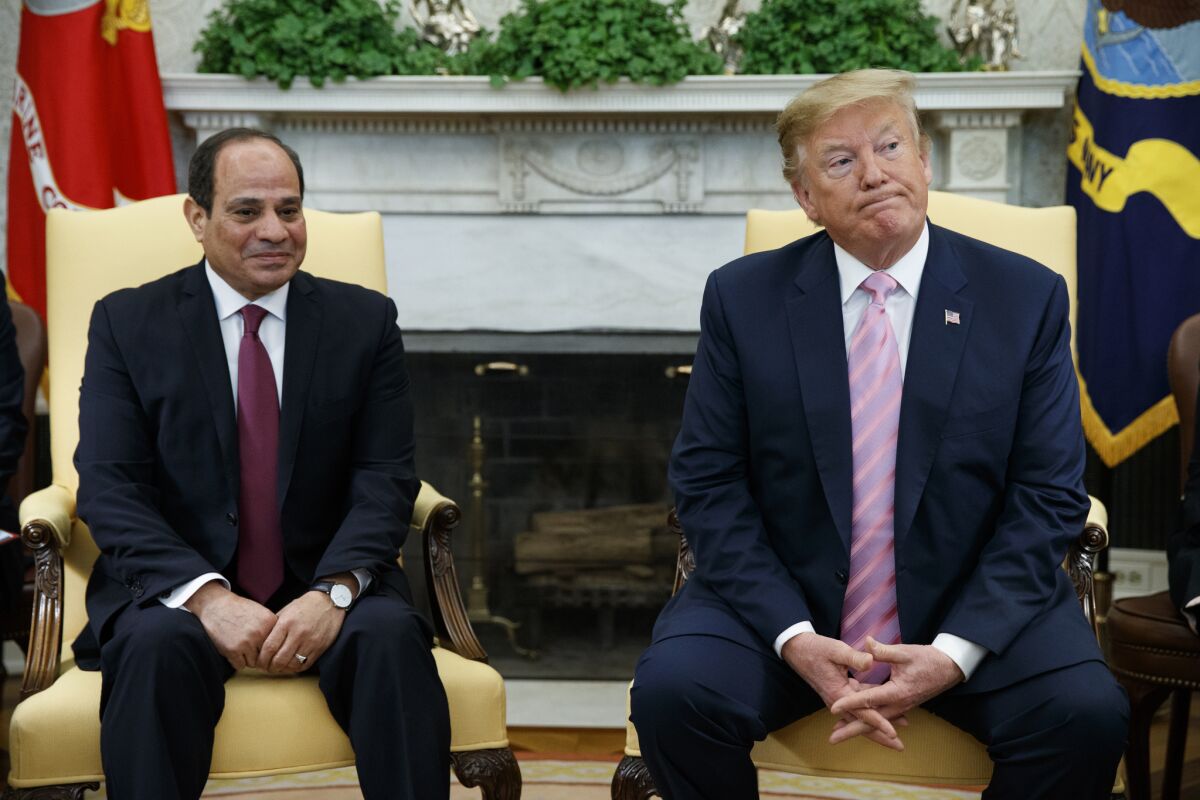 FILE - In this April 9, 2019 file photo, President Donald Trump meets with Egyptian President Abdel Fattah el-Sisi in the Oval Office of the White House in Washington. El-Sissi thanked Trump late Monday, Nov. 4, for his "generous concern" for helping revive Egypt's deadlocked dispute with Ethiopia over its construction of a massive upstream Nile dam. (AP Photo/Evan Vucci, File)