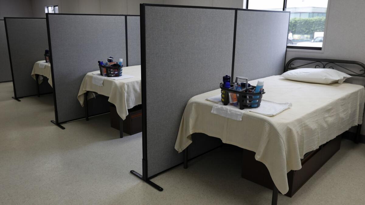 Beds inside a temporary shelter trailer facility in Los Angeles on Sept. 5. The facilities being constructed in Orange County are similar, though they may offer less privacy.