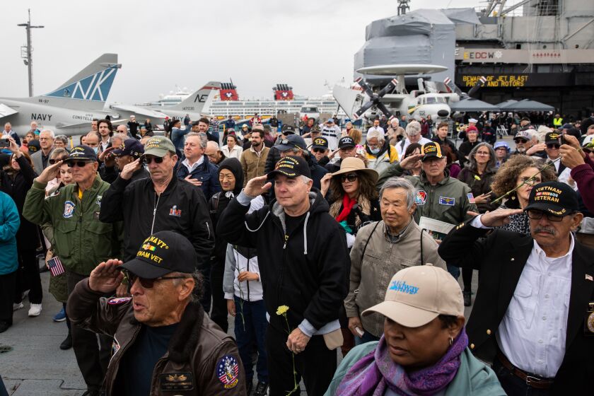 San Diego, CA - March 29: Veterans salute during a wreath laying ceremony honoring veterans and those who lost their lives during the Vietnam War at an event commemorating the 50th Anniversary of the end of the Vietnam War at the USS Midway Museum in San Diego, CA on Wednesday, March 29, 2023. (Adriana Heldiz / The San Diego Union-Tribune)
