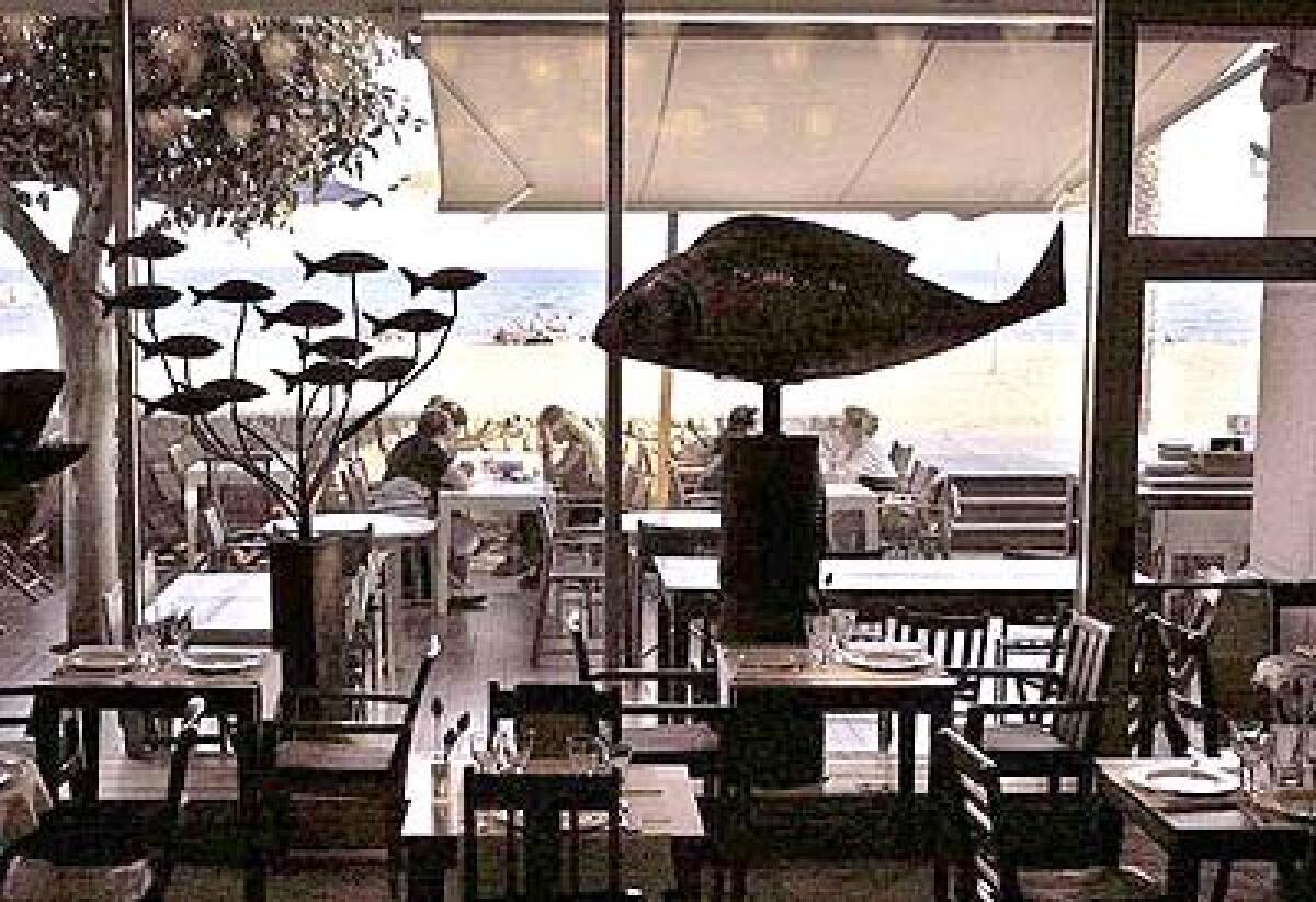 Big sculpted fish swim through Agua's airy modern dining room. The restaurant's outdoor tables are prime ocean-side real estate, offering a view of the promenade.