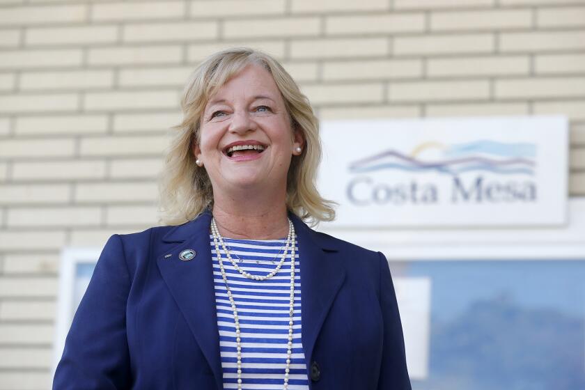 Mayor Katrina Foley in front of Costa Mesa City Hall. Foley walked away with a second term and 53% of the vote on Tuesday.
