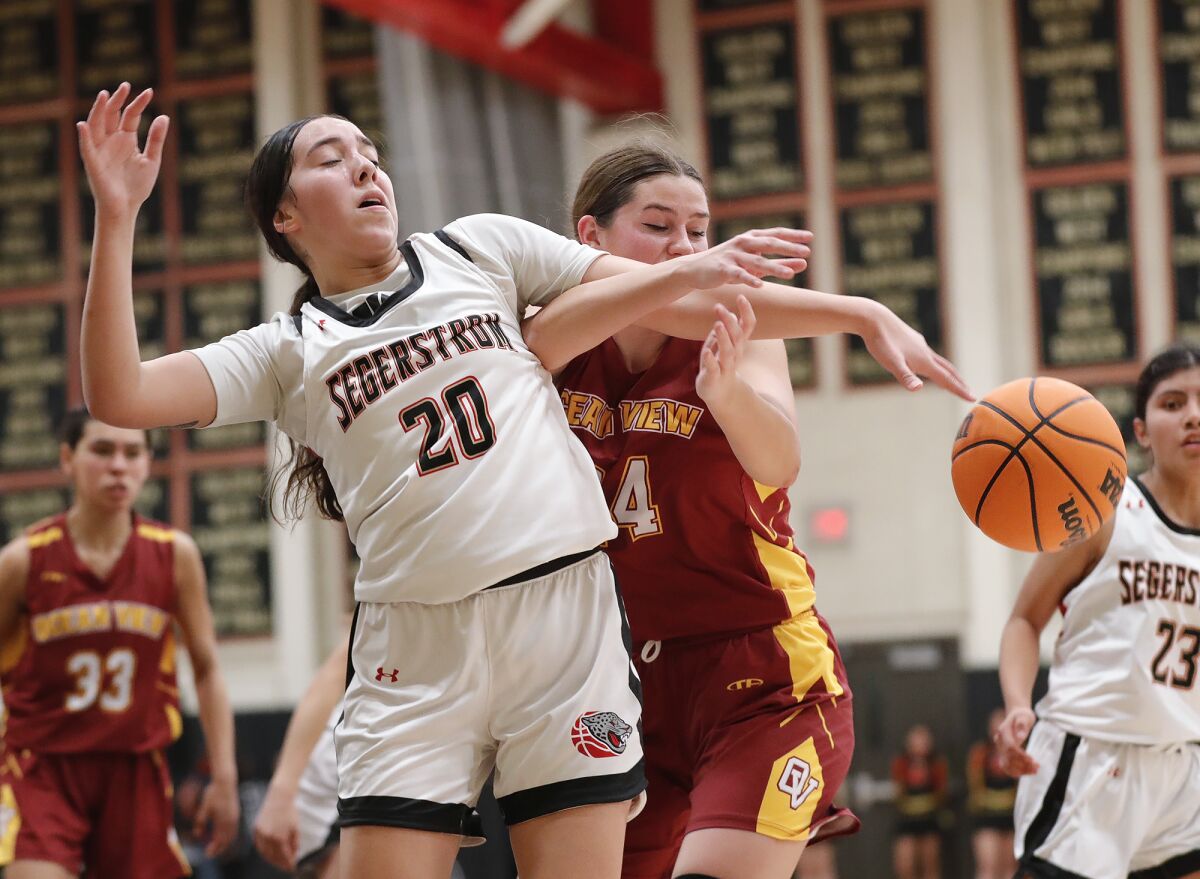 Ocean View's Lily Campbell and Segerstrom's Faith Ledesma will battle it out for the rebound in Wednesday's Golden West League game.