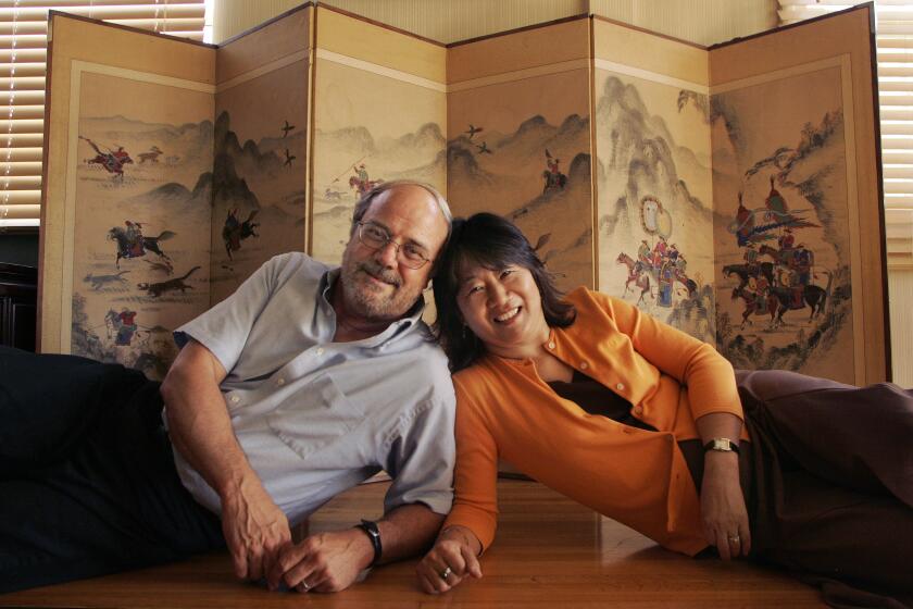 Hartog, Richard ññ ñ Prof. John Duncan, left, and wife Kay Duncan in front of a Korean pyongpoong (screen) at their home Tuesday in Westchester July 11, 2006. A takeout YOU ñña cross cultural story on the use of the pronoun YOU. In the hierarchal Korean culture YOU is seldom used.