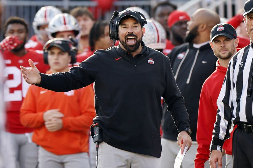 Ohio State head coach Ryan Day questions a referee's call during the second half of an NCAA college football game against Michigan on Saturday, Nov. 26, 2022, in Columbus, Ohio. (AP Photo/Jay LaPrete)
