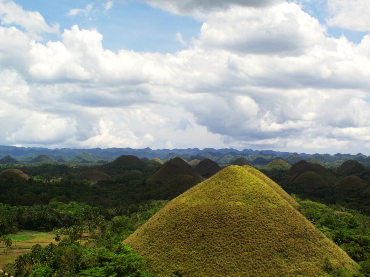Unlike most destinations, the Chocolate Hills are best viewed when they're dried and brown. This is when the hills, located in Bohol Province, Philippines, start to earn their name. During the dry season, the normally green grass covering the cone-shaped mounds turns brown, creating fields of chocolate-colored hills. More photos...