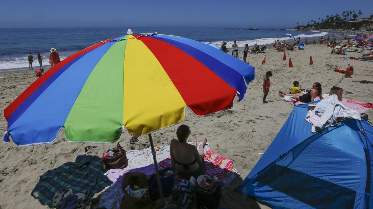 Beachgoers cavort in Laguna Beach, Calif. on June 26, 2017.