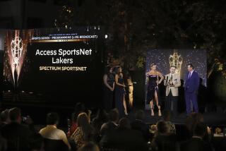 Dave Ramezzano accepts a sports series Emmy on behalf of Spectrum SportsNet's 'Access SportsNet Lakers' show in 2021.