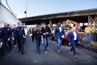 Gov.Gavin Newsom and Los Angeles Mayor Karen Bass at the site of a fire under Interstate 10 in Los Angeles.