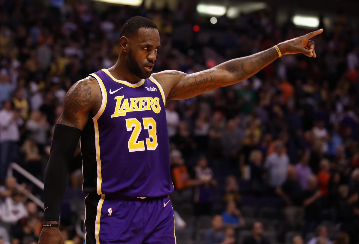 PHOENIX, ARIZONA - NOVEMBER 12: LeBron James #23 of the Los Angeles Lakers reacts during the final moments of the NBA game against the Phoenix Suns at Talking Stick Resort Arena on November 12, 2019 in Phoenix, Arizona. The Lakers defeated the Suns 123-115. NOTE TO USER: User expressly acknowledges and agrees that, by downloading and/or using this photograph, user is consenting to the terms and conditions of the Getty Images License Agreement (Photo by Christian Petersen/Getty Images) ** OUTS - ELSENT, FPG, CM - OUTS * NM, PH, VA if sourced by CT, LA or MoD **