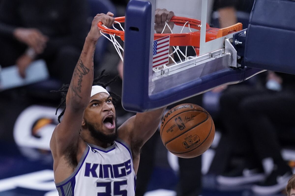 Sacramento Kings' Marvin Bagley III dunks during the first half of the team's NBA basketball game against the Indiana Pacers, Wednesday, May 5, 2021, in Indianapolis. (AP Photo/Darron Cummings)