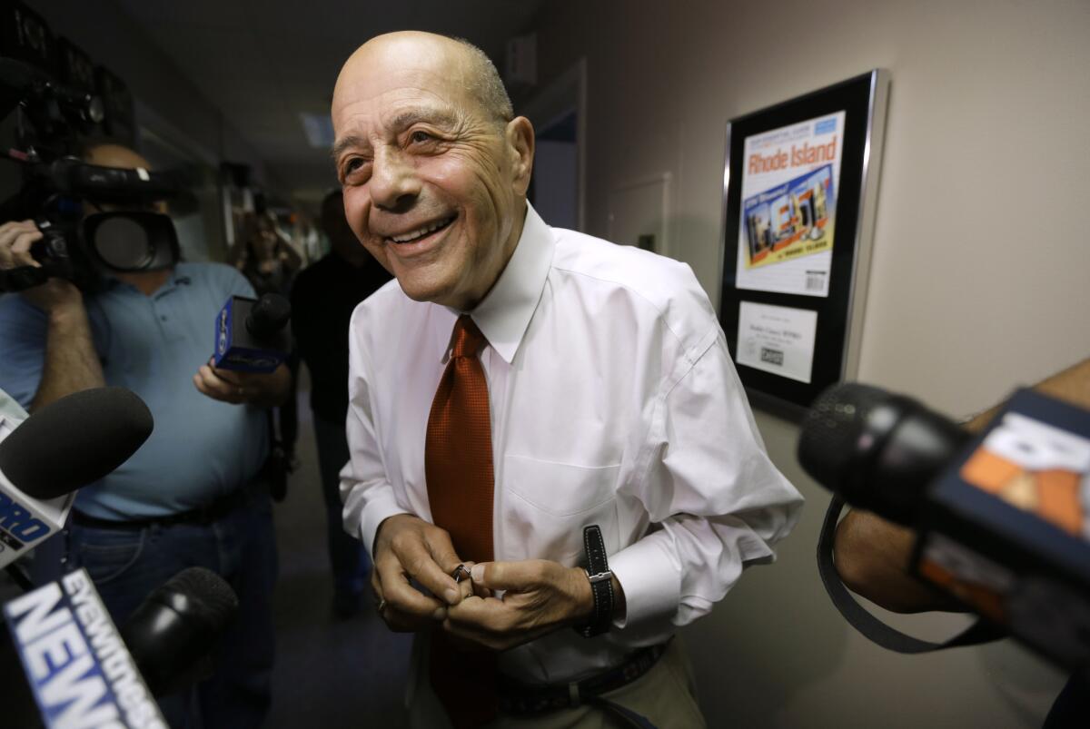 Former Providence Mayor Buddy Cianci speaks with reporters at the WPRO-AM in East Providence, R.I. moments after announcing on the air that he will run again for mayor of Providence. Cianci was the longest-serving mayor of the city, elected to six terms for 21 years.