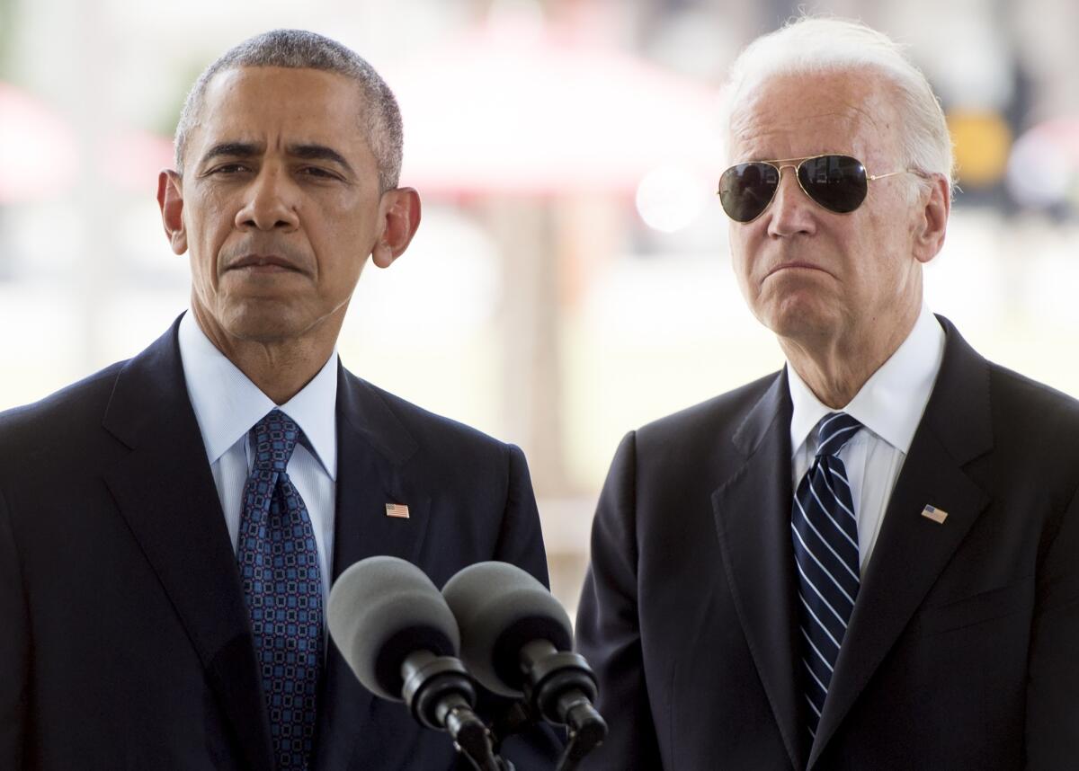 President Obama and Vice President Joe Biden at a memorial in Orlando, Fla., for the victims of Sunday's mass shooting at a gay nightclub.