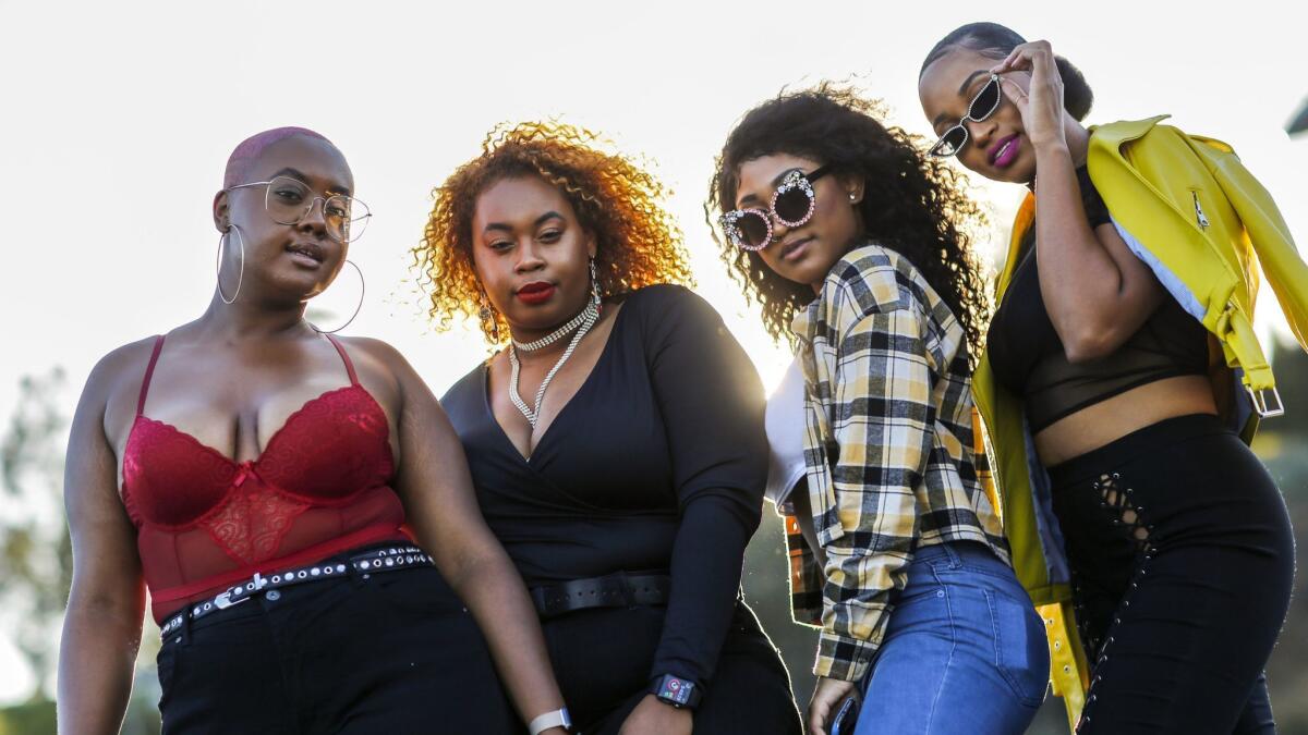 Yaasmeen Coussey, from left, Najjiya Coussey, Rian Castillo and Amira Heath pause for a photo outside the Rose Bowl before Beyoncé and Jay-Z's concert Saturday.