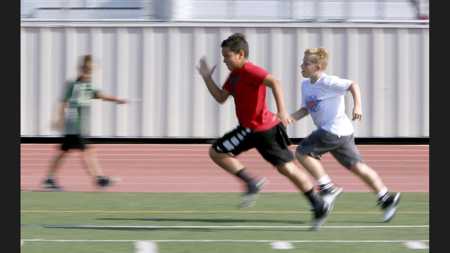 Photo Gallery: Football camp at Burroughs High School for six- to thirteen-year olds