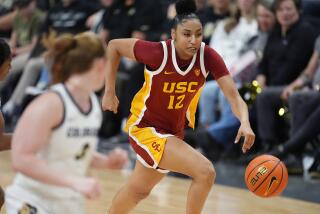 Southern California guard JuJu Watkins, right, pursues a loose ball with Colorado.