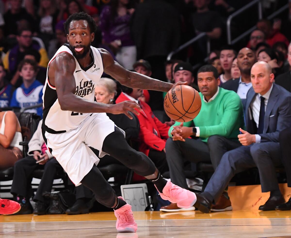 Clippers guard Patrick Beverley drives to the basket during Christmas Day game against the Lakers at Staples Center.