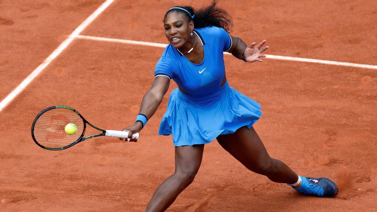 Serena Williams volleys a shot against Kristina Mladenovic during a third-round match Saturday at the French Open.