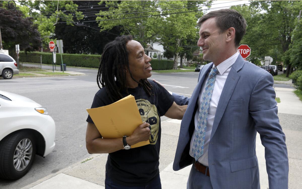 Debbie Africa speaking to her attorney Brad Thomson. 