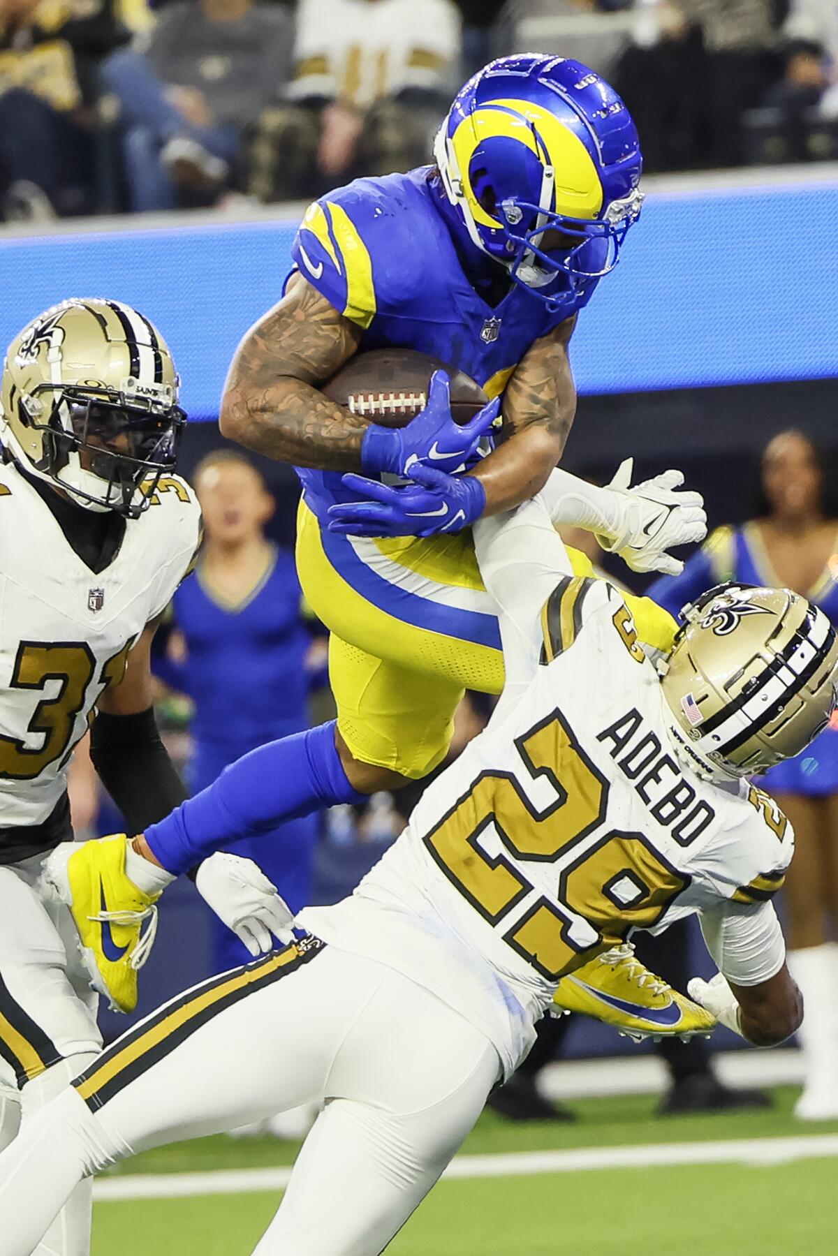 The Rams' Kyren Williams leaps into the end zone for a 10-yard touchdown run against the Saints.