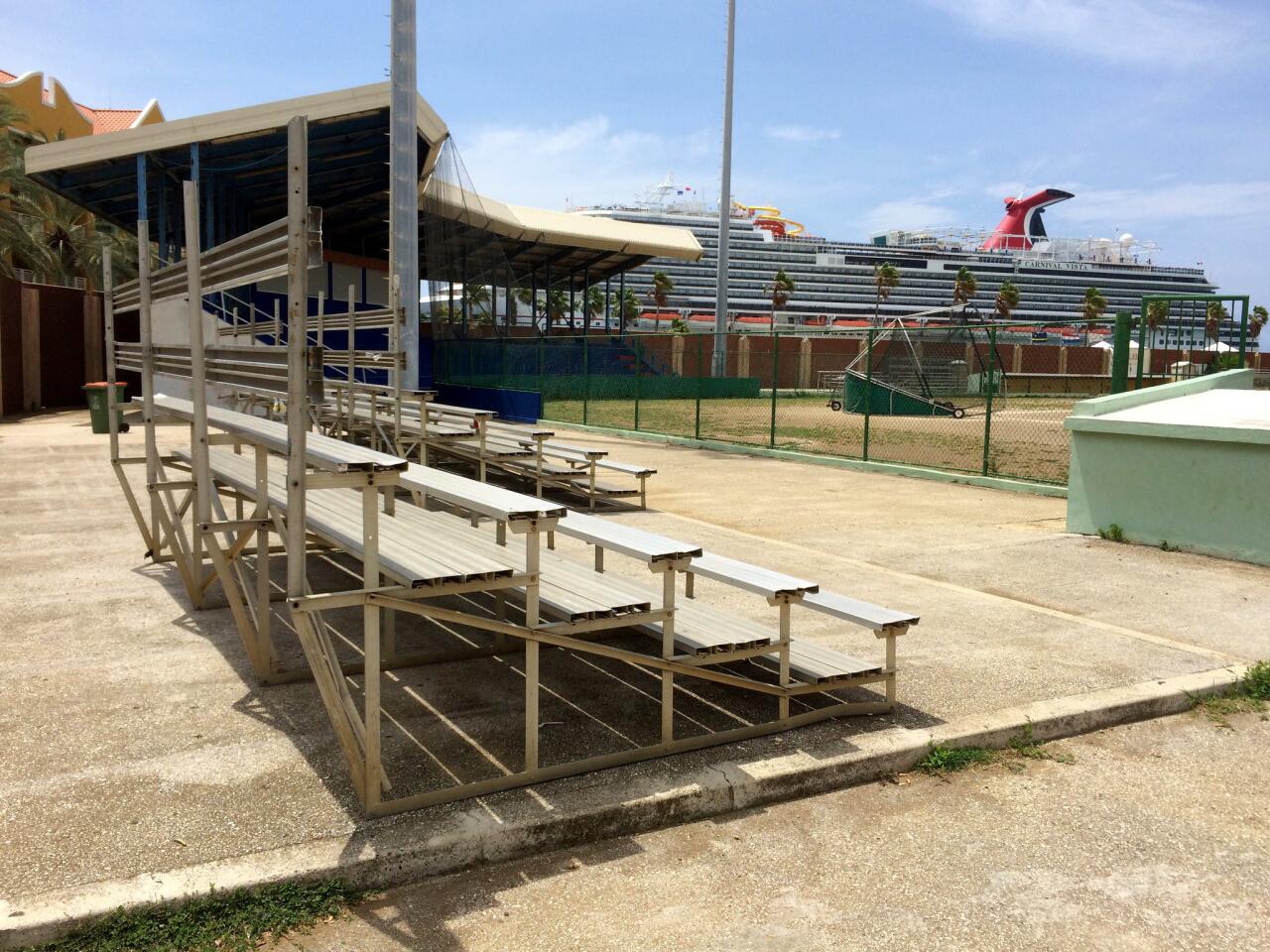 A cruise ship rises just beyond the left-field foul line of CuracaoÕs largest ballpark.