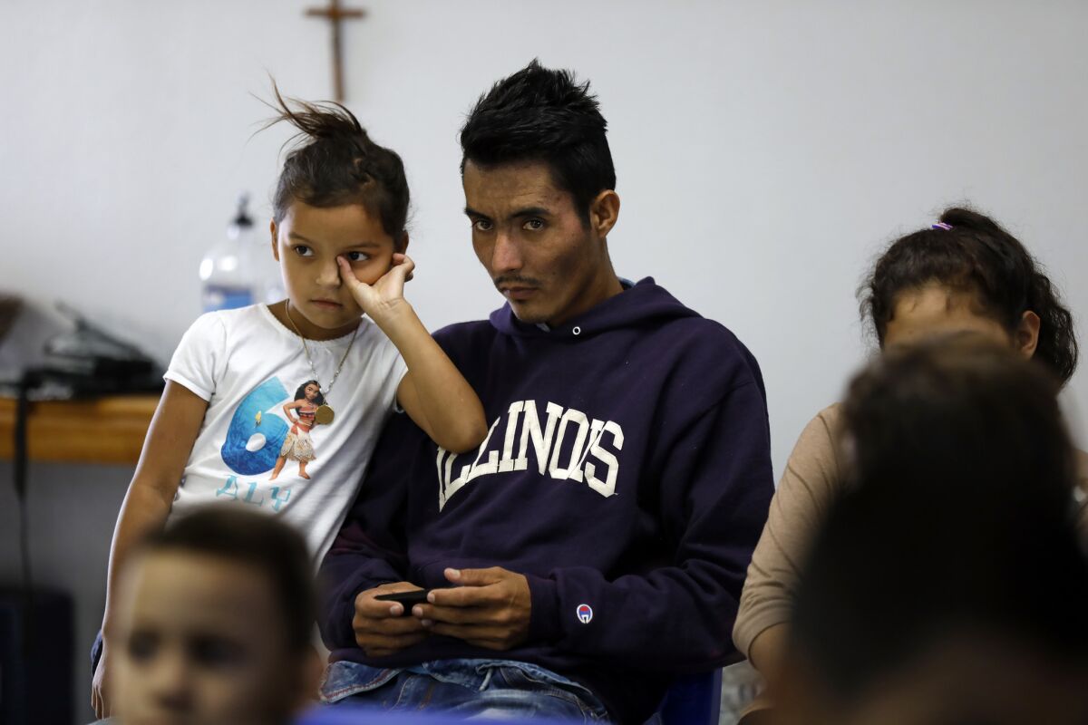 Wilson Ortega, 32, and his daughter Adrian, 8, at a shelter in McAllen, Texas.