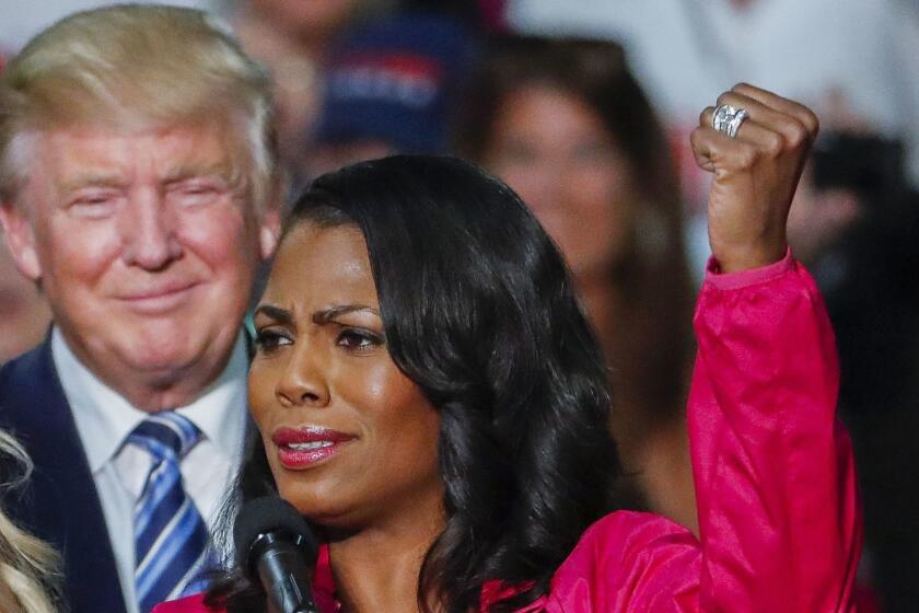Mandatory Credit: Photo by ERIK S LESSER/EPA-EFE/REX/Shutterstock (9787214a) (FILE) - Then US Republican presidential nominee Donald J. Trump (L) participates in a campaign rally with members of the group Women for Trump with Omarosa Manigault (R) in Charlotte, North Carolina, USA, 14 October 2016 (reissued 10 August 2018). Former White House aide Omarosa Manigault-Newman in a new book claims that Trump had repeatedly used a racial slur during making of one of his TV shows. Former WH advisor claims Trump repeatedly used racial slur, Charlotte, USA - 14 Oct 2016 ** Usable by LA, CT and MoD ONLY **
