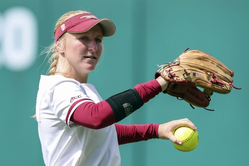 FILE - Florida State outfielder Kaley Mudge (6) warms up before an NCAA college softball game against Maris on Friday, May 19, 2023, in Tallahassee, Fla. (AP Photo/Gary McCullough, File)