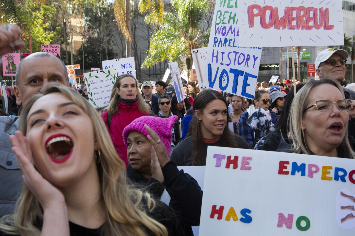 LOS ANGELES, CA-JANUARY 18, 2020: Claire New-Duval, left, and Trinity Castaneda, 18, cheer during the 4th annual Women’s March Los Angeles kickoff at Pershing Square in dowtown Los Angeles. (Gabriella Angotti-Jones/Los Angeles Times)