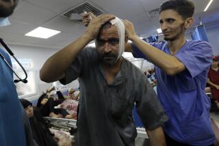 FILE - An injured Palestinian man receives treatment at the al-Shifa hospital, following Israeli airstrikes on Gaza City, central Gaza Strip, Sunday, Nov. 5, 2023. Gaza's Shifa Hospital has become the focus of a days-long stalemate in Israel's war against Hamas. Israel claims Hamas uses the facility for military purposes and has built a vast underground command center below the hospital. Since Israel declared war against Hamas, its forces have moved in on Shifa. But hundreds of doctors and patients remain inside. (AP Photo/Abed Khaled, File)