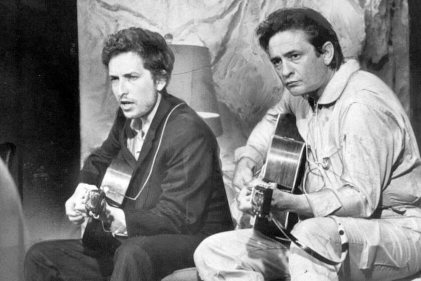 The new documentary "Johnny Cash: American Rebel" recalls the life of the country music legend. Bob Dylan, left, and Johnny Cash in 1969.