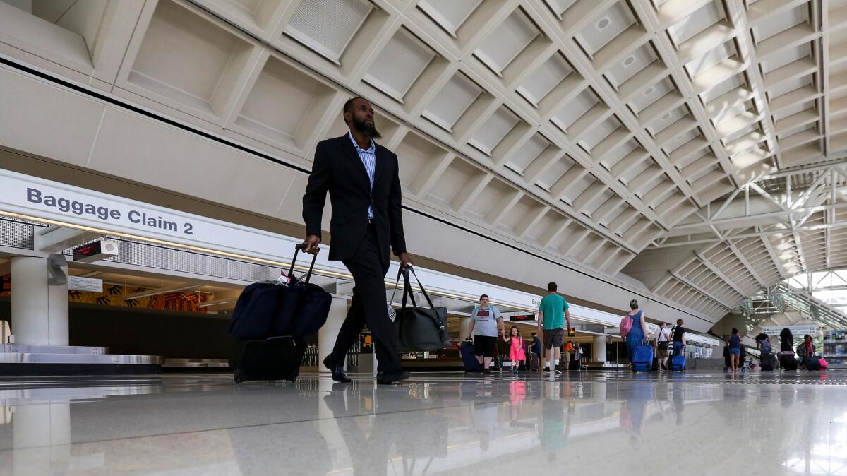 Passengers at L.A./Ontario International Airport in 2015. The airport will be turned over to local control on Nov. 1 and will change its name to Ontario International Airport.