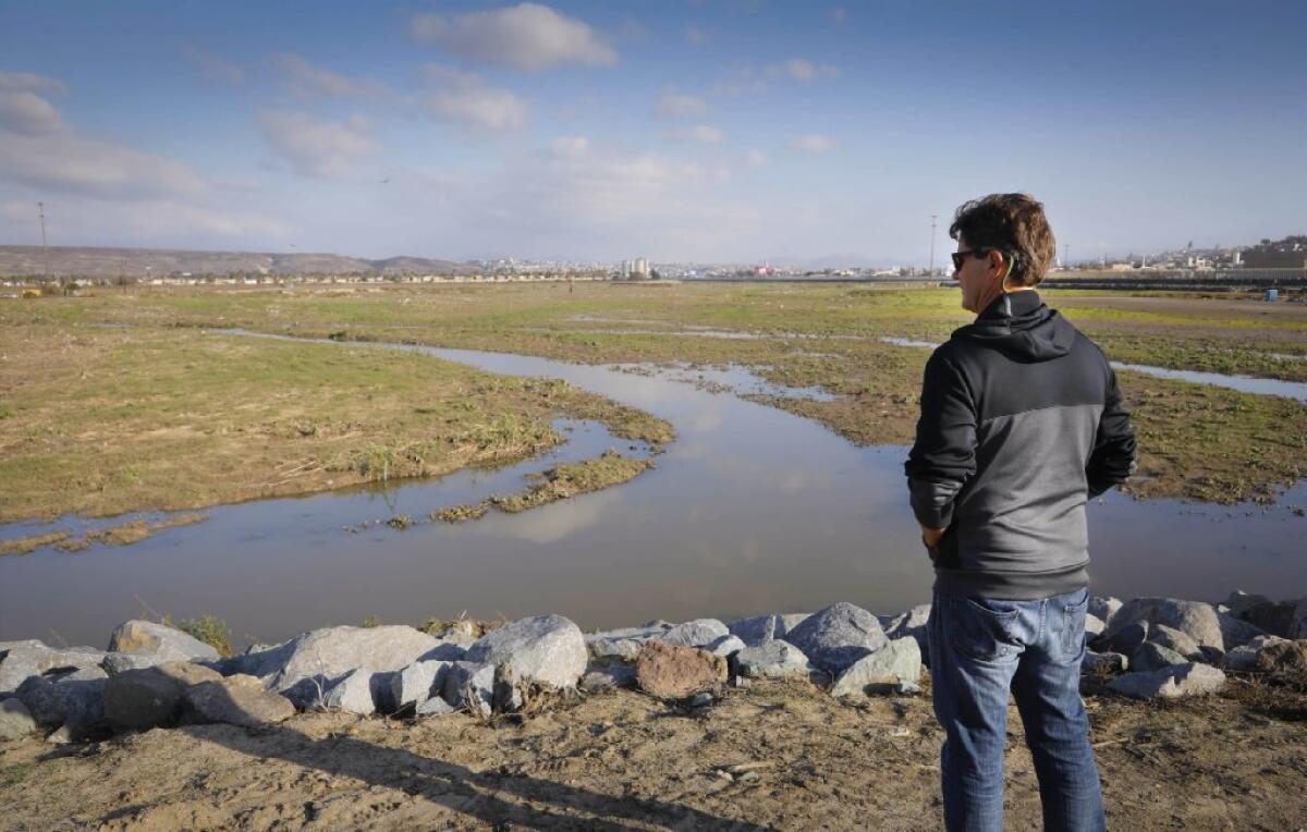 In this 2018 photo, Imperial Beach, Calif., Mayor Serge Dedina surveys the Tijuana River Valley.