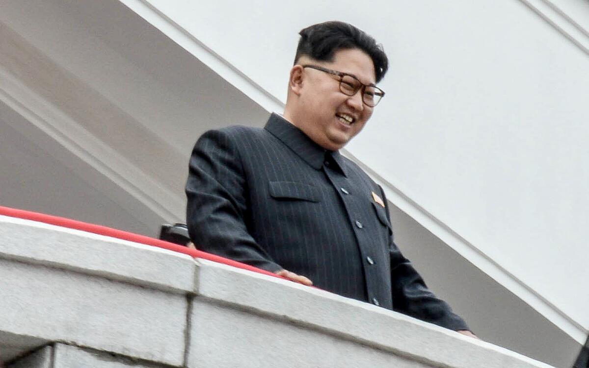 North Korean leader Kim Jong Un looks down on parade participants at the Kim Il Sung Square in Pyongyang, North Korea.