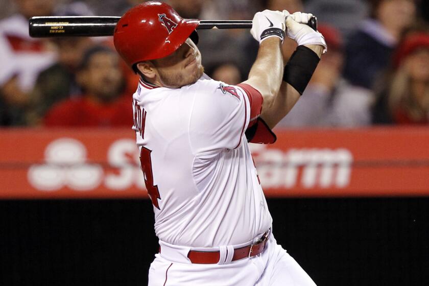 Angels first baseman C.J. Cron hits a sacrifice fly against the Houston Astros on May 8, 2015.
