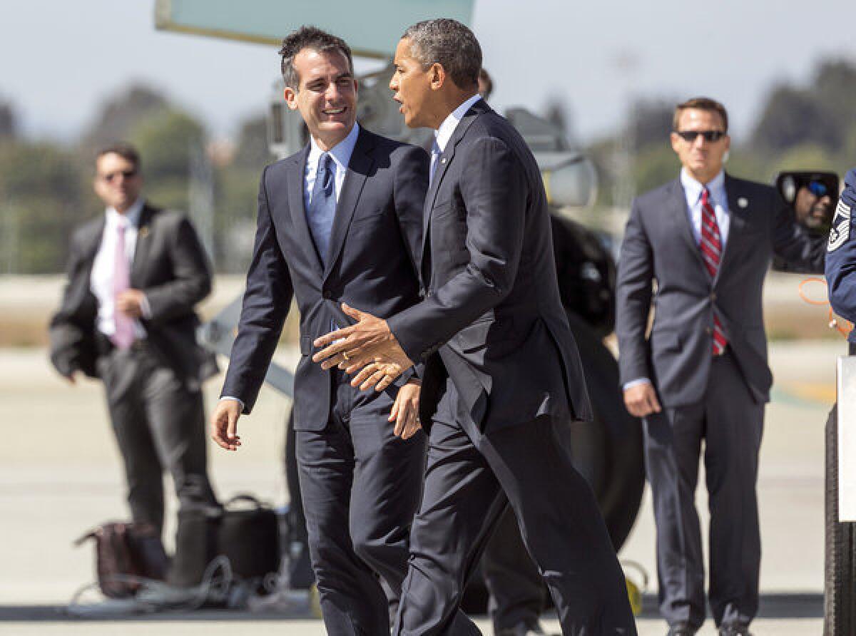 In August, Mayor Eric Garcetti, left, welcomes President Obama as he steps off of Air Force One at Los Angeles International Airport.