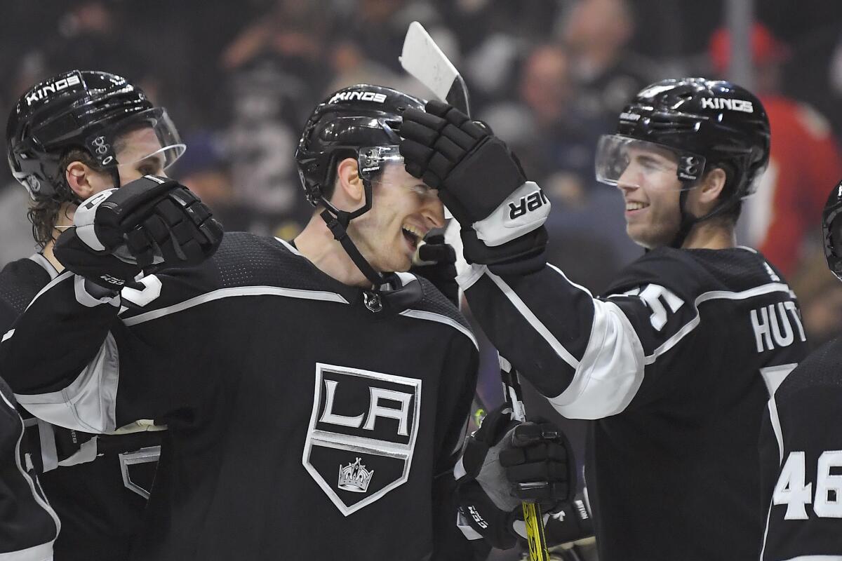 Kings center Gabriel Vilardi is congratulated by defenseman Ben Hutton, right,  after a 5-4 victory over the Florida Panthers on Thursday. Vilardi scored a goal in the first period.