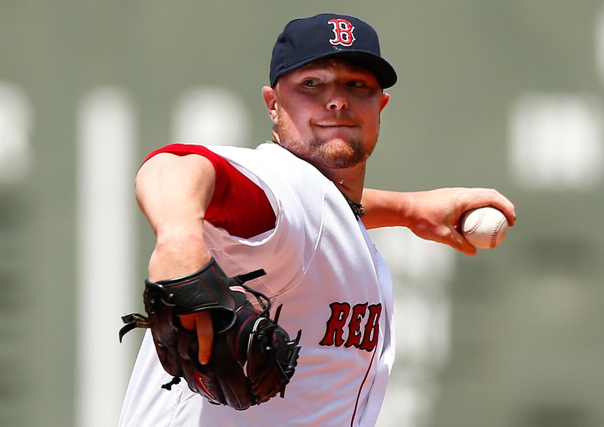 Jon Lester is going from the AL East to the AL West.