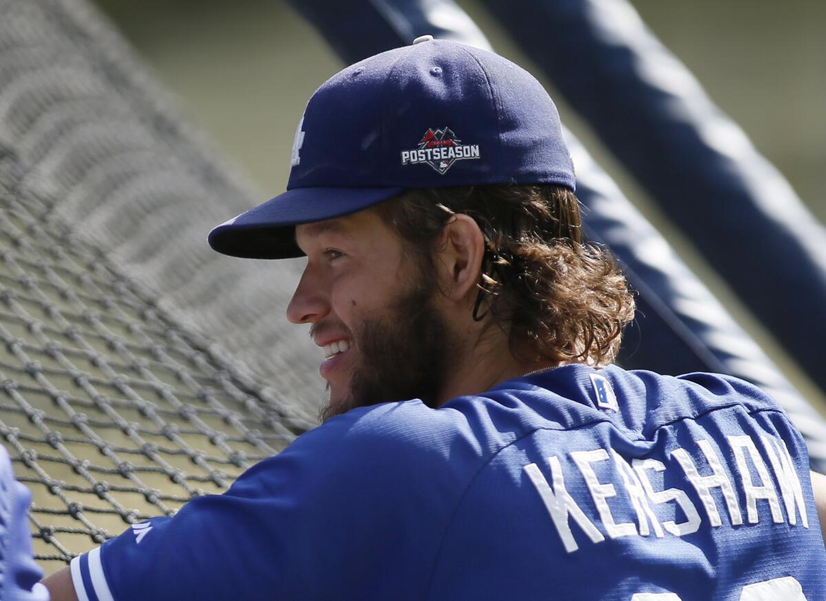 Dodgers pitcher Clayton Kershaw takes part in practice Tuesday for the upcoming National League division series against the Mets. Kershaw has been announced as the Game 1 starter.