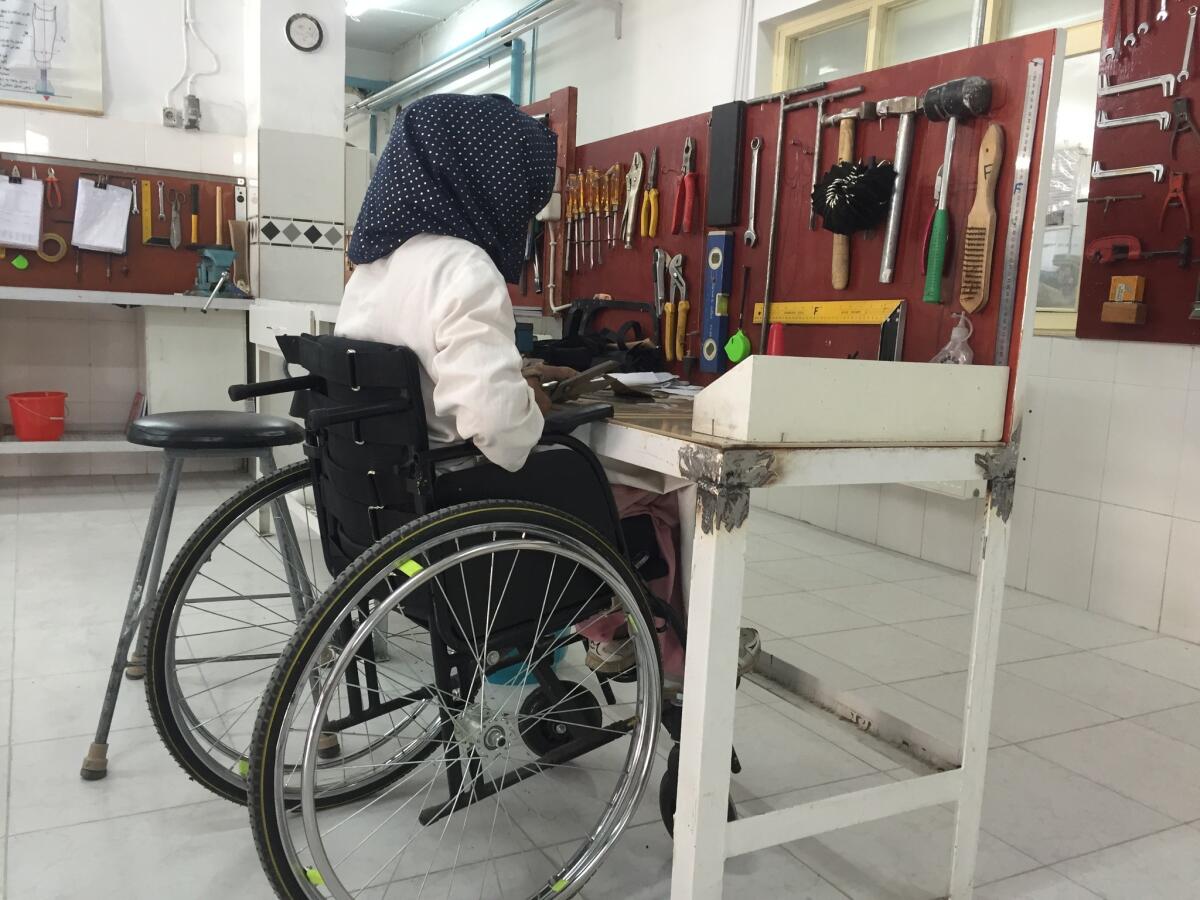 Wajeeta, 23, molds artificial limbs at a Red Cross rehabilitation center in Kabul, Afghanistan.