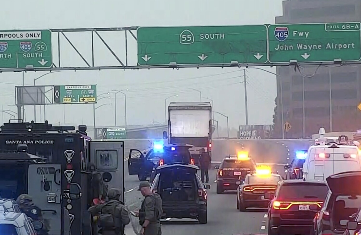 Pursuit of stolen big rig ends in five-hour standoff on 55 Freeway in Santa Ana