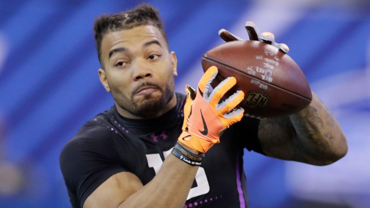 Former Louisiana State running back Derrius Guice runs a drill during the NFL scouting combine on March 2 in Indianapolis.