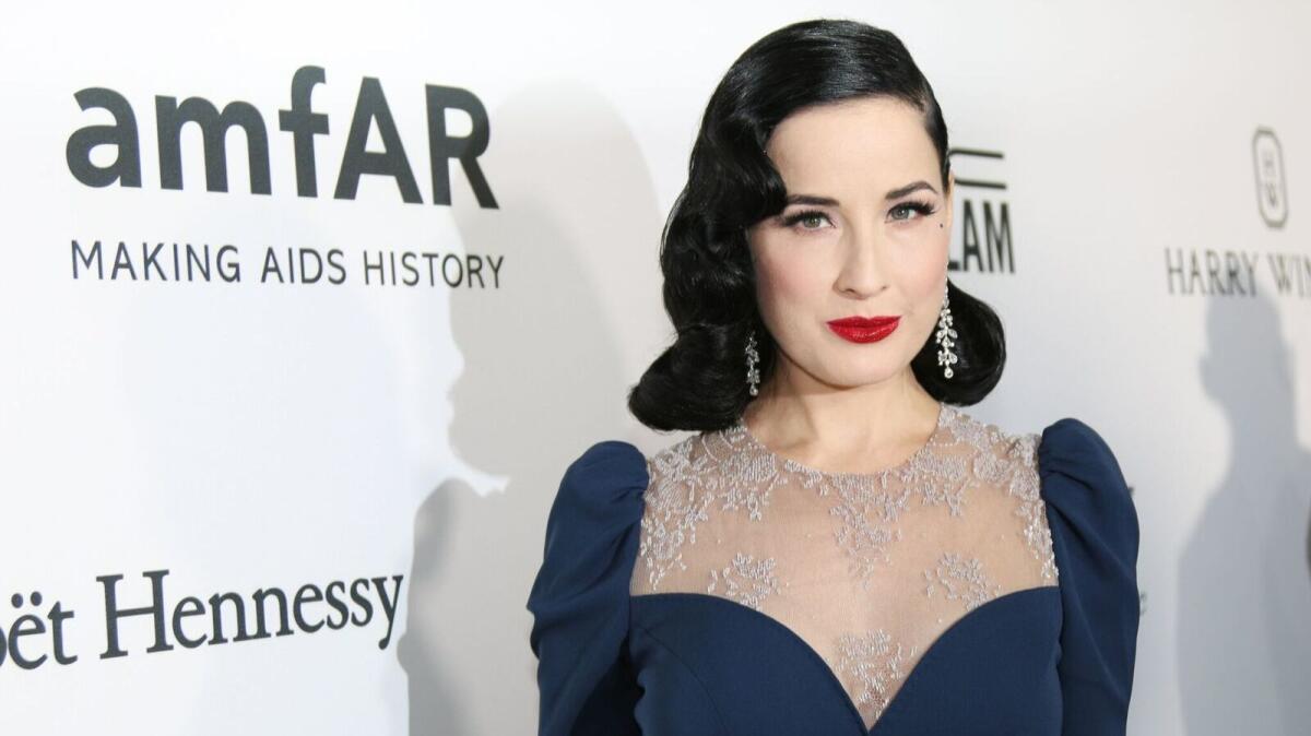 Dita Von Teese in a blue dress