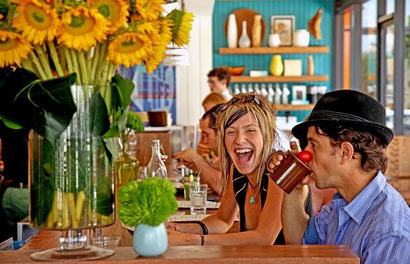 Singer Adey Bell of Oregon gets a kick out of actor Alexander Polinsky's clown nose at Cafe Gratitude.