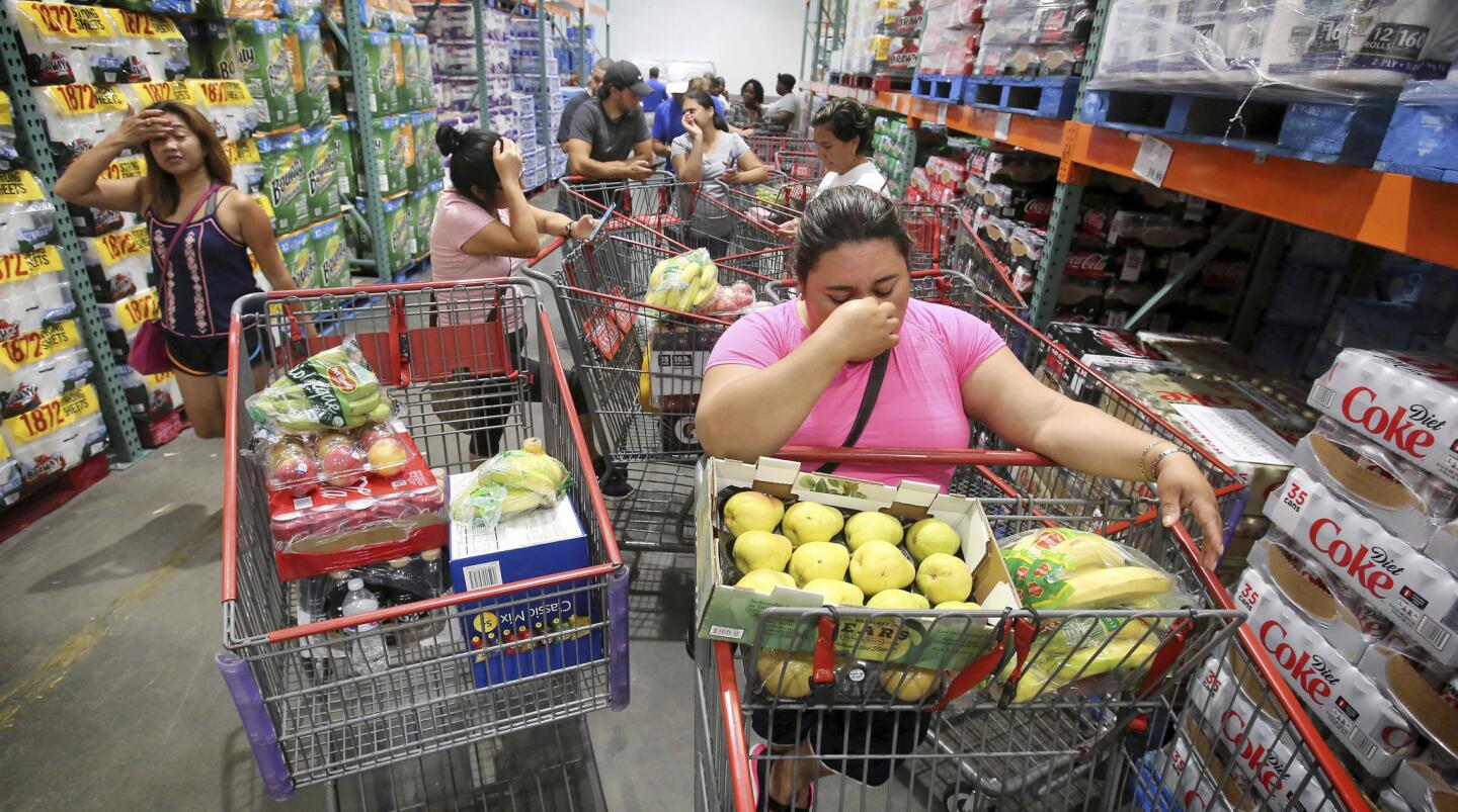 Shoppers wait in line for the arrival of a shipment of water during preparations for the impending arrival of Hurricane Irma on Sept. 6, 2017 in Altamonte Springs, Fla.