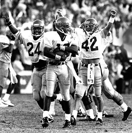 There was plenty for USC's Rodney Peete (center), Aaron Emanuel (24) and Erik Affholter (42) to celebrate in 1988. Peete recovered from a case of the measles to lead the Trojans to a 31-22 victory, earning USC a second consecutive trip to the Rose Bowl at the expense of UCLA.