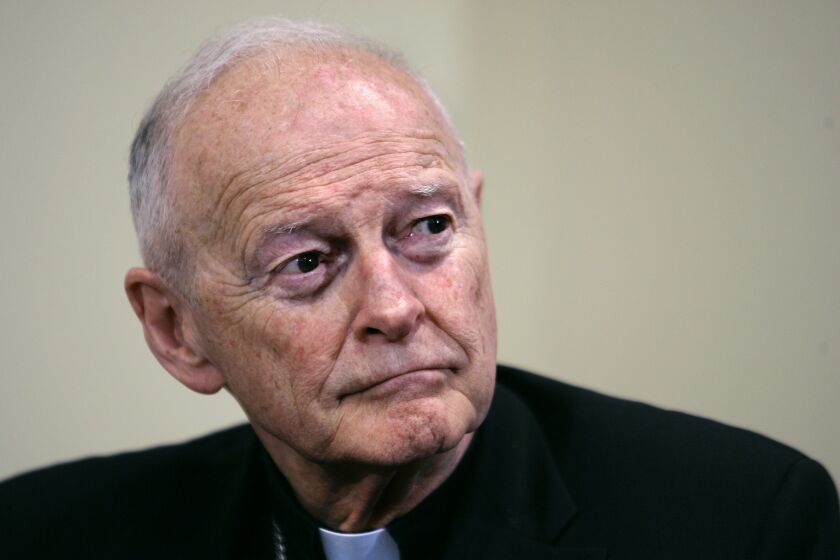FILE - In this May 16, 2006 file photo former Washington Archbishop, Cardinal Theodore McCarrick pauses during a press conference in Washington. McCarrick, the once-influential American cardinal who was defrocked after a Vatican investigation confirmed he had sexually molested adults as well as children, has been charged with sexually assaulting a 16-year-old boy during a wedding reception at Wellesley College in the 1970s, court records show. (AP Photo/J. Scott Applewhite, File)