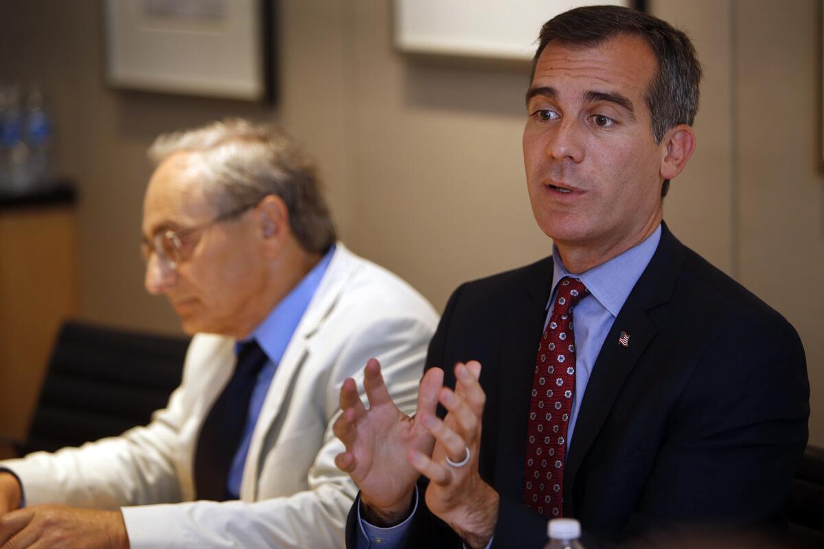 Los Angeles Mayor Eric Garcetti, right, with Michael Reich, professor of economics and director of the Institute for Research on Labor and Employment at UC Berkeley, meets with the Los Angeles Times Editorial Board.